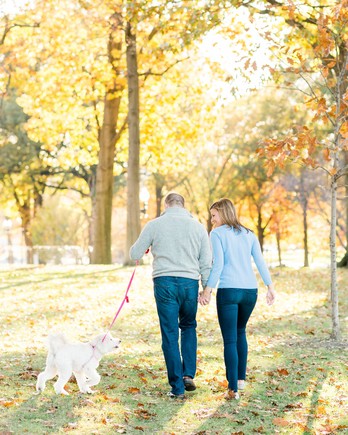 couple walking with dog 