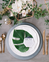 Island Time 33 Tropical Wedding Ideas We Love Martha Weddings Place Setting With Tropical Palm Leaf On Plate