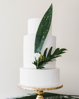 30 Amazing Beach Wedding Cakes Martha Weddings Three Tiered White Cake With Tropical Leaves
