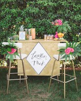 Island Time 33 Tropical Wedding Ideas We Love Martha Weddings Tropical Wedding Bar With Fern And Palm Decorations
