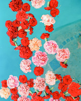 caitlin amit indian wedding flowers floating in pool