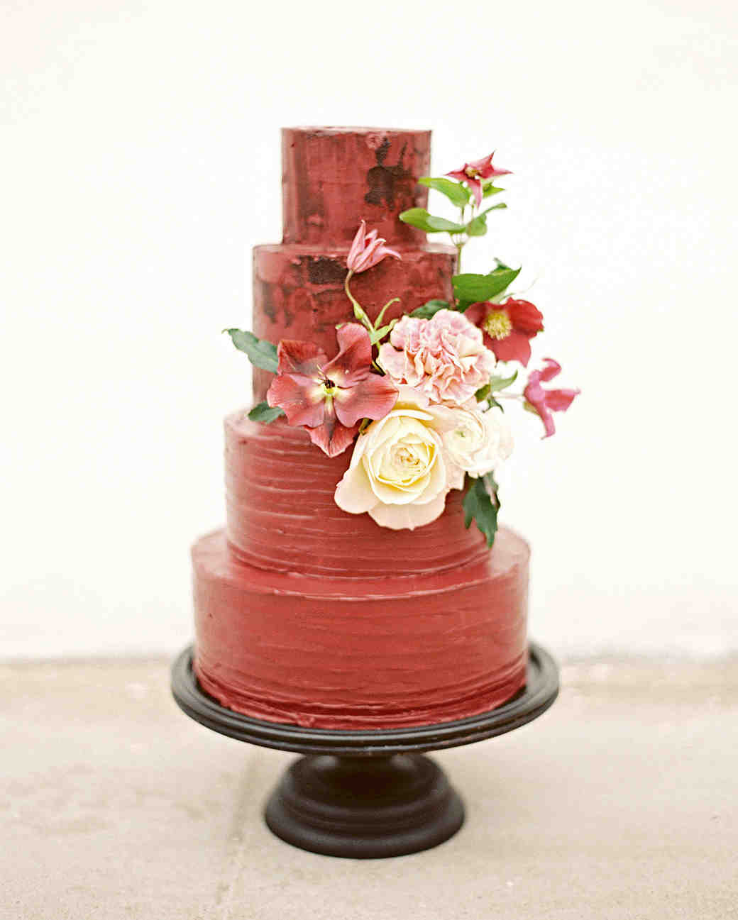 red velvet tiered cake with blooms