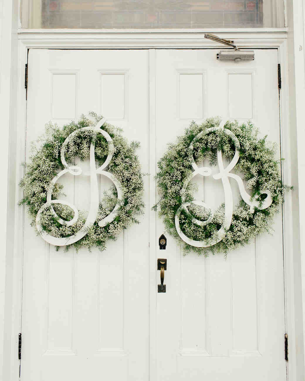 28 Ideas That Prove Wreaths Aren T Just For Martha Wedding Wreaths Monogramed Hanging On White Double Doors