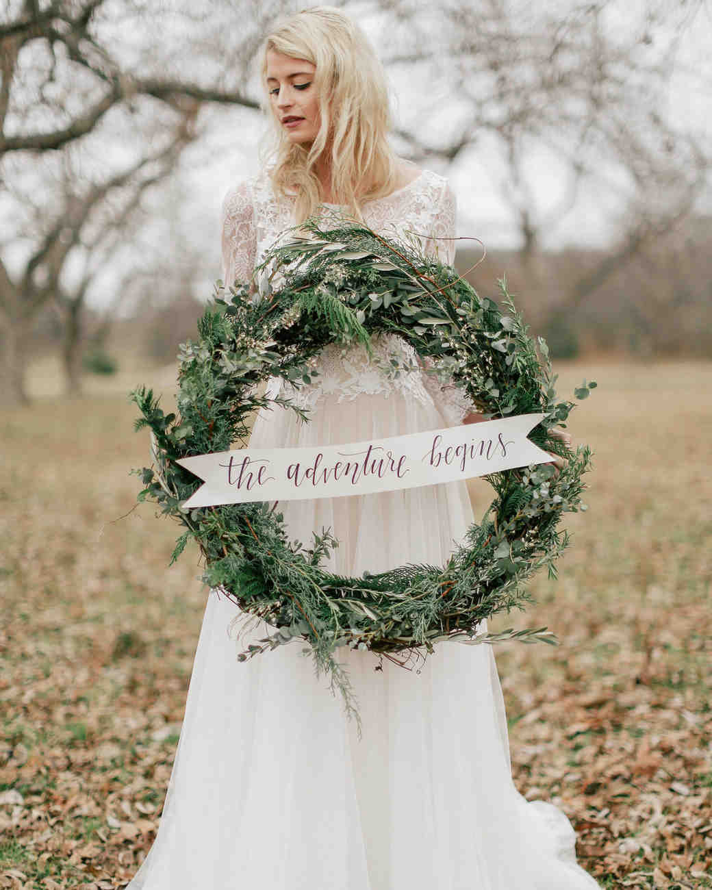 28 Ideas That Prove Wreaths Aren T Just For Martha Wedding Wreath With Sign Held By Bride