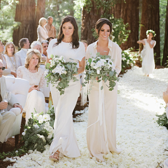 Two Bridesmaids Walking Down Aisle Together Two Bridesmaids Walking Down Aisle Together