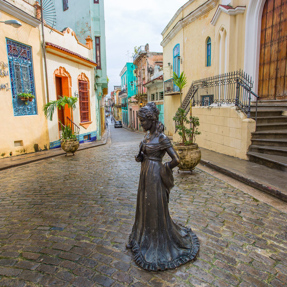 Cuban street with statue Cuban street with statue