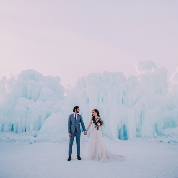 Bride and Groom Posing with Ice Castle Bride and Groom Posing with Ice Castle