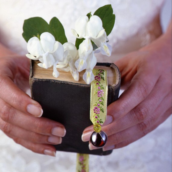 Carry the family bible or your father’s favorite book of poems down the aisle