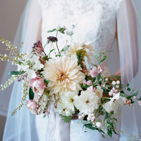 bride holding floral wedding bouquet bride holding floral wedding bouquet
