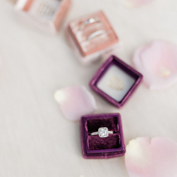 Asscher-cut center stone and smaller diamonds halo shaped ring Asscher-cut center stone and smaller diamonds halo shaped ring