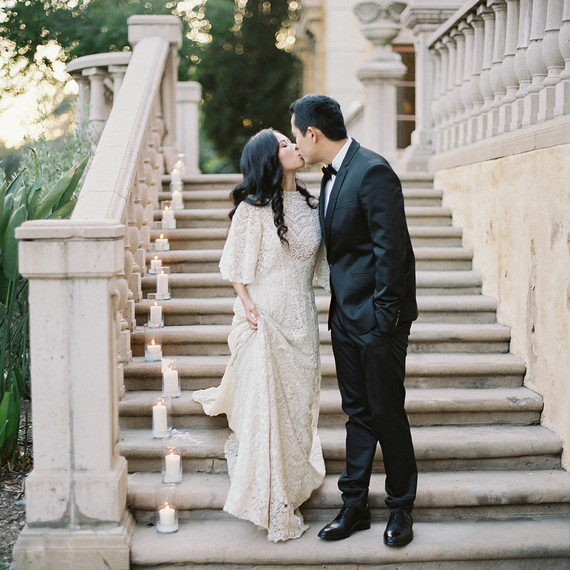emme daji wedding couple kissing on staircase emme daji wedding couple kissing on staircase