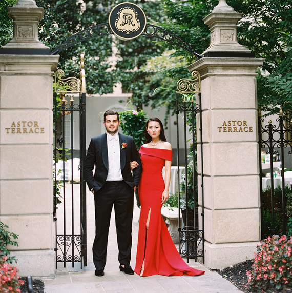 groom with bride wearing red reception dress groom with bride wearing red reception dress