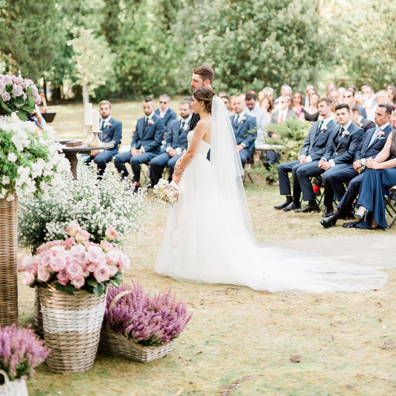 bride and groom standing outdoor wedding ceremony bride and groom standing outdoor wedding ceremony