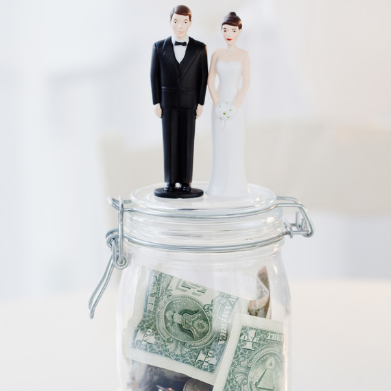 bride and groom figurines on money jar bride and groom figurines on money jar