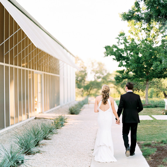 amanda chuck wedding couple walking by venue amanda chuck wedding couple walking by venue