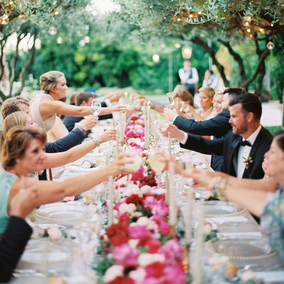 allie and joe italy wedding guests cheersing allie and joe italy wedding guests cheersing