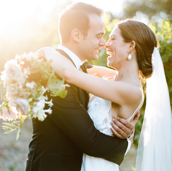 cristina chris wedding couple embrace laughing cristina chris wedding couple embrace laughing