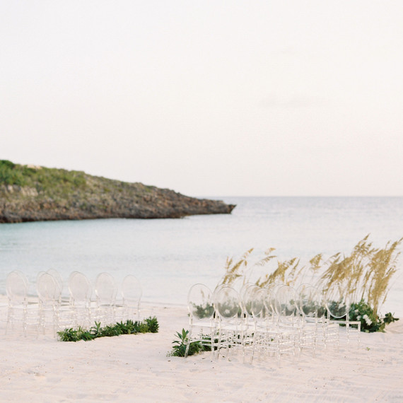 lucite chairs arranged on a beach lucite chairs arranged on a beach