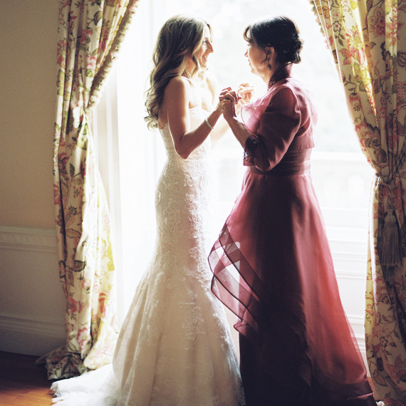 A Bride and Her Mom Holding Hands Before the Wedding A Bride and Her Mom Holding Hands Before the Wedding