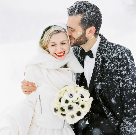 bride and groom in snow bride and groom in snow