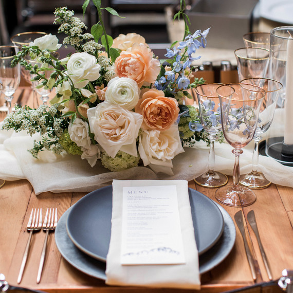 wedding place setting with men and floral arrangement wedding place setting with men and floral arrangement