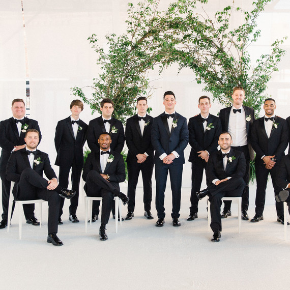 wedding groomsmen group shot with greenery wedding groomsmen group shot with greenery