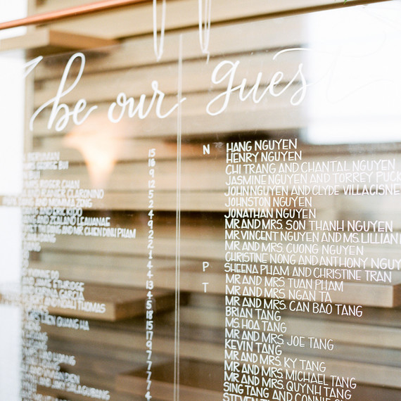 wedding seating chart white lettering on glass wedding seating chart white lettering on glass
