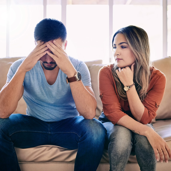 Couple Sitting on Couch Arguing Couple Sitting on Couch Arguing