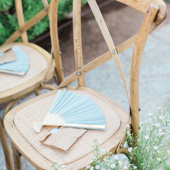 Elegant outdoor wedding ceremony with paper fans Elegant outdoor wedding ceremony with paper fans