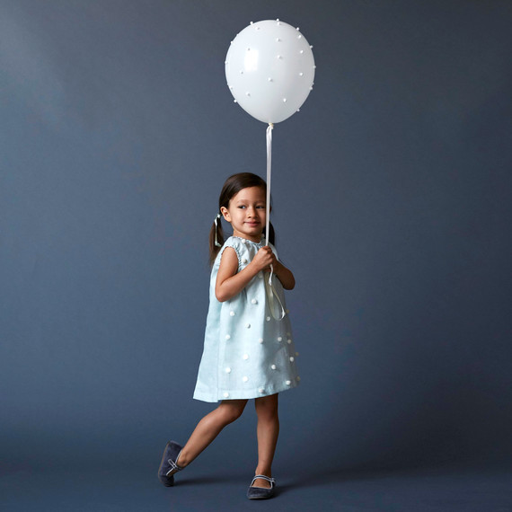 kid with pom pom balloon opener kid with pom pom balloon opener