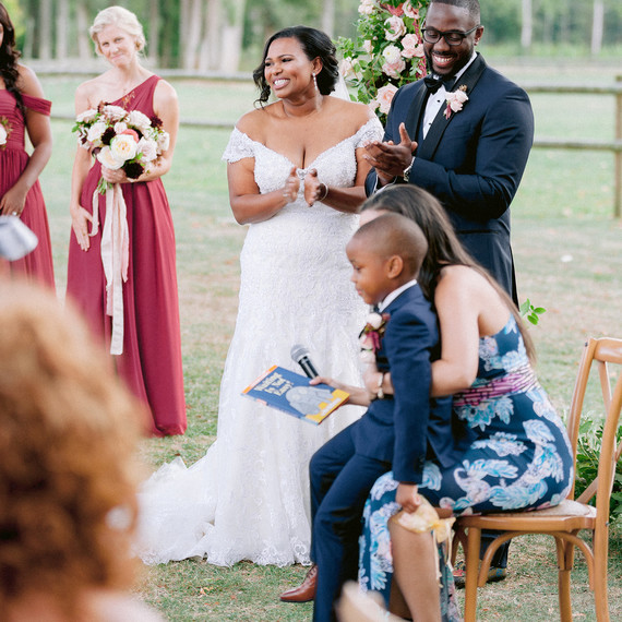 natalie elijah wedding ceremony couple at altar with child natalie elijah wedding ceremony couple at altar with child