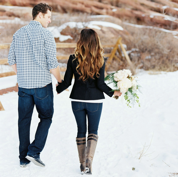 couple walking in snow couple walking in snow
