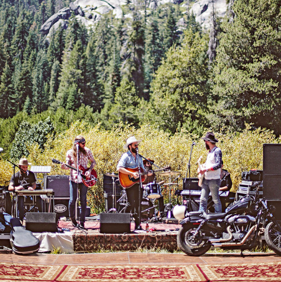 wedding band in front of woods and mountains wedding band in front of woods and mountains