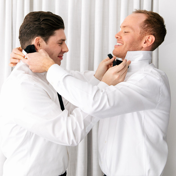 michael thomas wedding couple getting ready tying ties michael thomas wedding couple getting ready tying ties