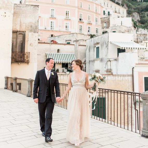 elopement outfit inspiration couple holding hands outside of italian villa elopement outfit inspiration couple holding hands outside of italian villa