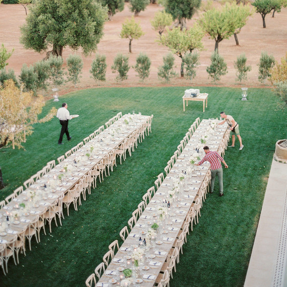 vendors setting up tables for a wedding reception vendors setting up tables for a wedding reception
