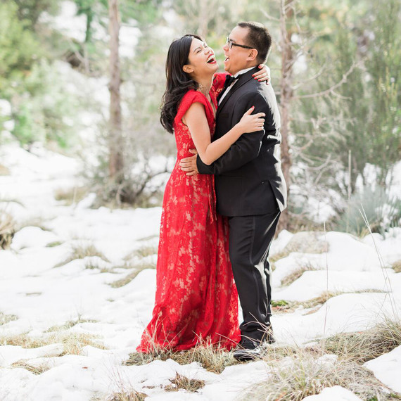couple laughing snow couple laughing snow