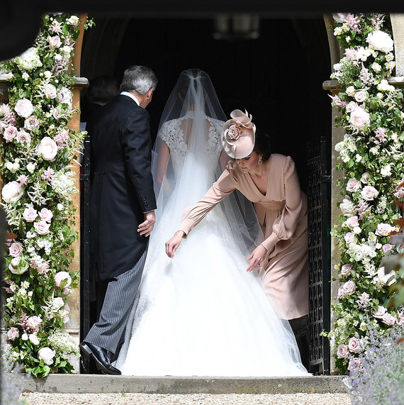 Duchess Kate adjusting Pippa Middleton wedding dress Duchess Kate adjusting Pippa Middleton wedding dress