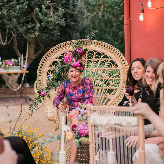 Guests at this boho-chic bachelorette party laugh and mingle while playing games Guests at this boho-chic bachelorette party laugh and mingle while playing games