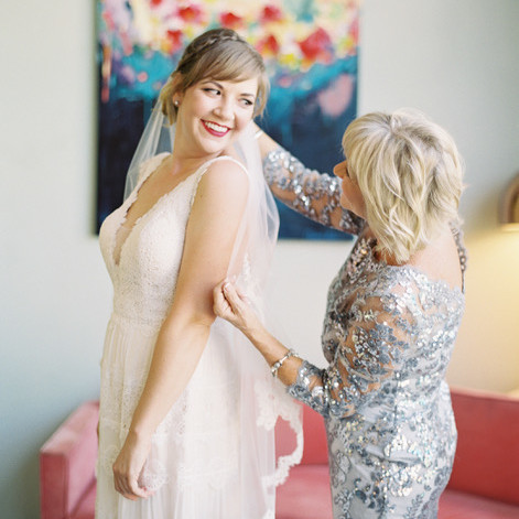 A Mother Helping Her Daughter Put On Her Wedding Veil A Mother Helping Her Daughter Put On Her Wedding Veil