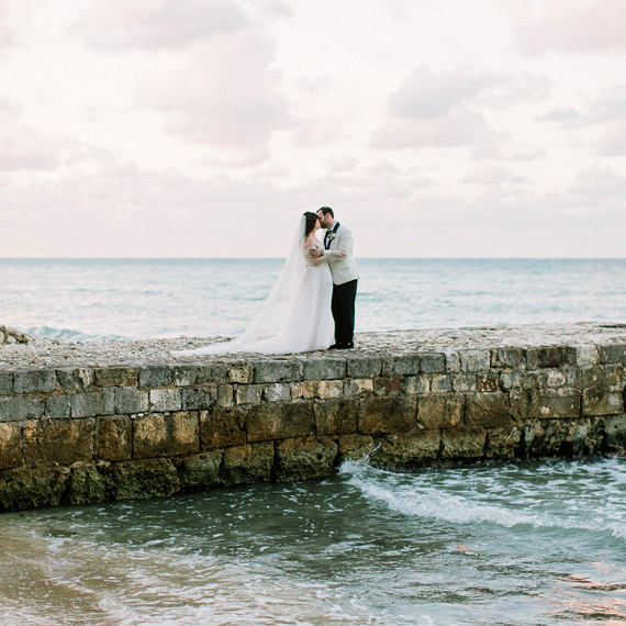 abbey jeffrey wedding couple kiss on stone pier abbey jeffrey wedding couple kiss on stone pier