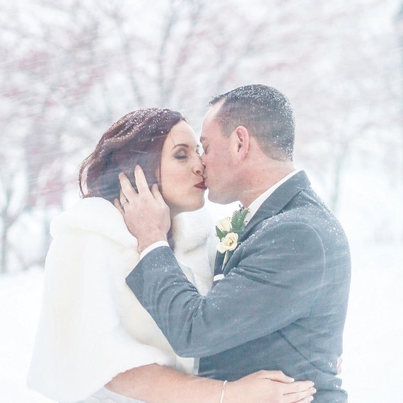 jonas-storm-winter-wedding-photo-kiss-in-snow-0116.jpg