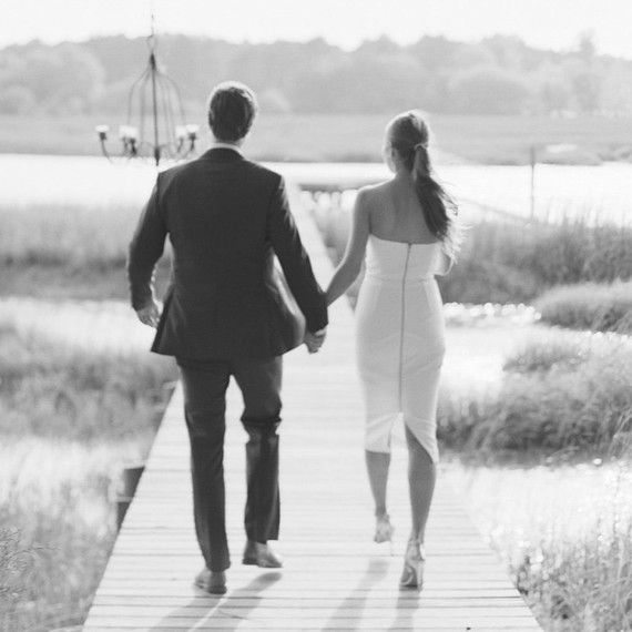Black and White Engagement Photo of a Couple Walking Black and White Engagement Photo of a Couple Walking