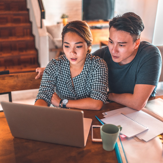 Couple Looking at Computer Couple Looking at Computer