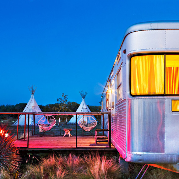 metal trailer with teepees in background metal trailer with teepees in background