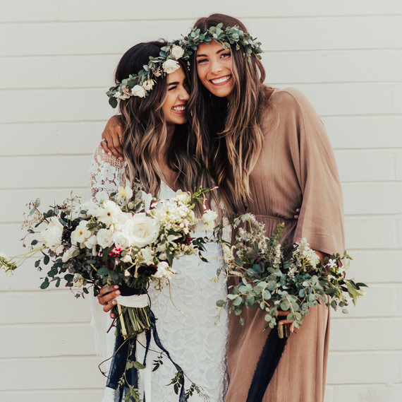 bride and maid of honor wearing matching headpieces bride and maid of honor wearing matching headpieces