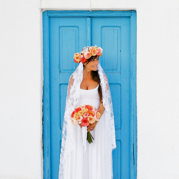 unique wedding color palette bride in front of bright blue door unique wedding color palette bride in front of bright blue door