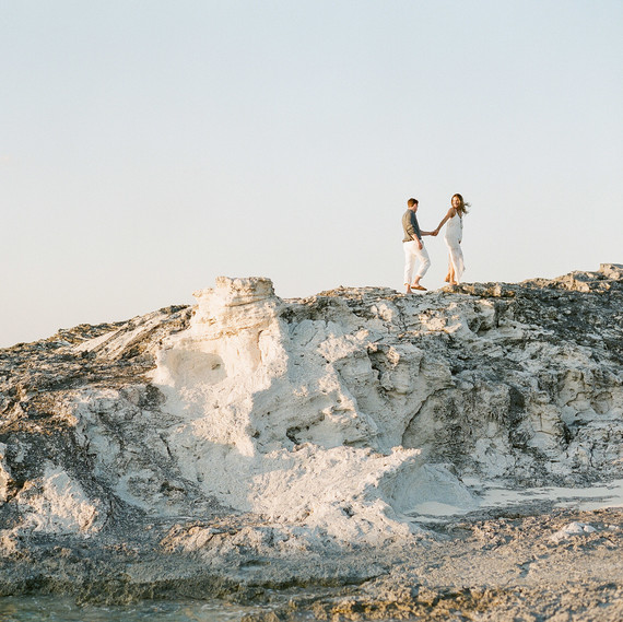 destination engagement couple high rocks on private island destination engagement couple high rocks on private island